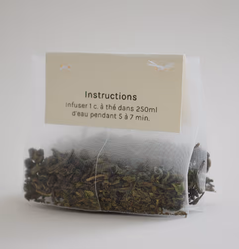 Credit: Emilia Piazza Close-up of Gourmet Sauvage tea bag with loose tea leaves and an instructions label in French