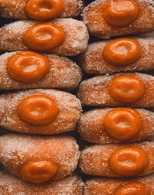 credit CHAT GPT
stacked bomboloni with dulce de leche filling